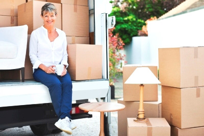 senior woman with moving boxes